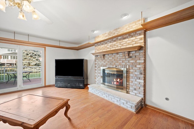 living room with a fireplace and hardwood / wood-style flooring