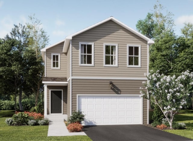 view of property with a garage and a front lawn