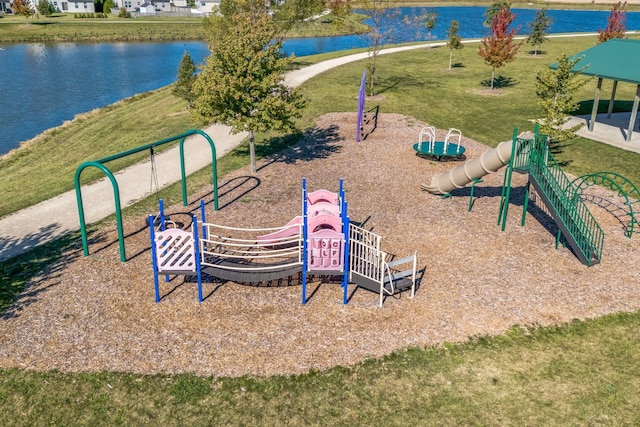 view of jungle gym with a yard and a water view