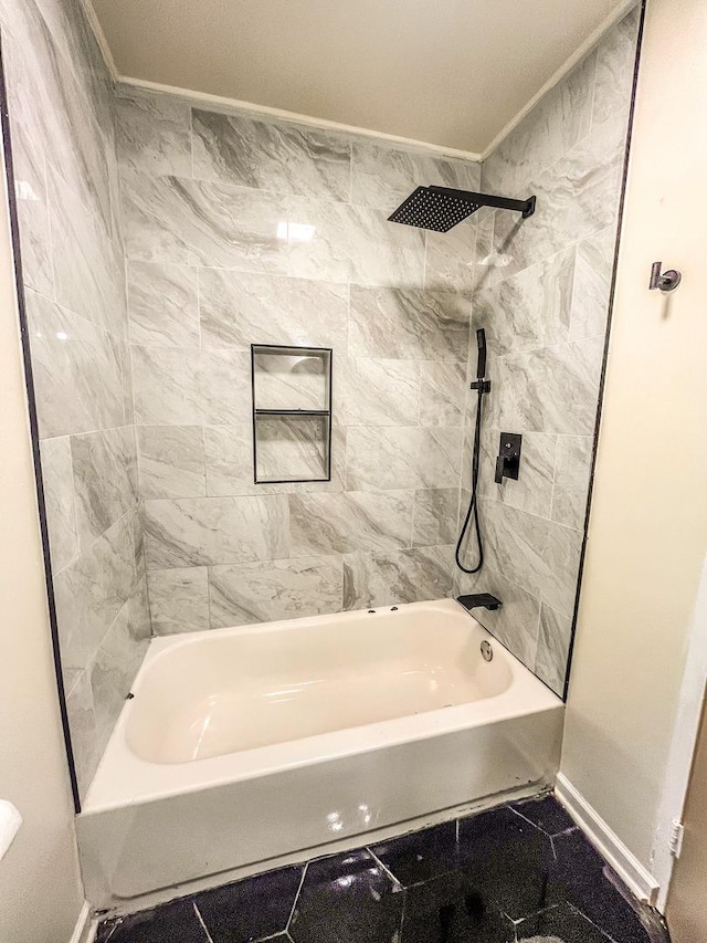 bathroom featuring tiled shower / bath and ornamental molding