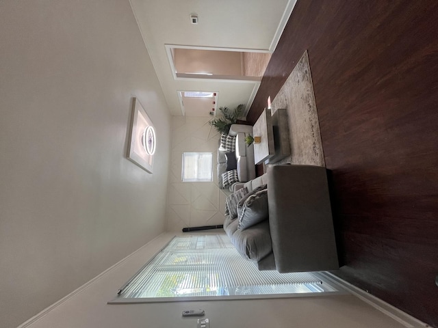 living room featuring wood walls