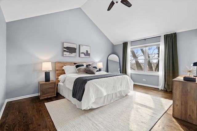 bedroom with lofted ceiling, dark wood-type flooring, and ceiling fan