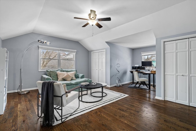 living room featuring ceiling fan, plenty of natural light, dark hardwood / wood-style floors, and lofted ceiling