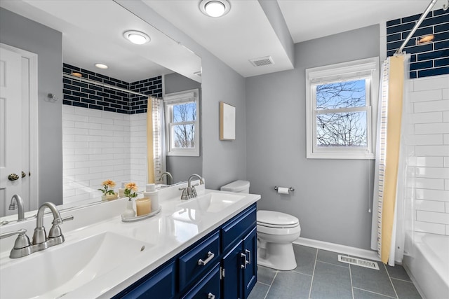 full bathroom featuring shower / bath combination with curtain, toilet, vanity, and tile patterned flooring