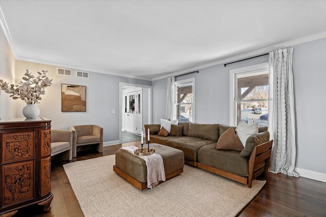 living room featuring wood-type flooring and ornamental molding