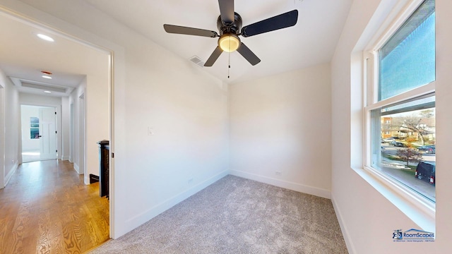 empty room featuring ceiling fan and light wood-type flooring