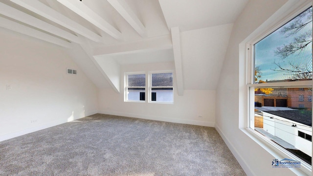 bonus room with vaulted ceiling with beams and carpet