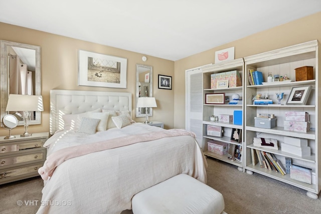 bedroom with dark colored carpet