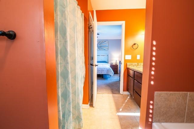 bathroom featuring tile patterned floors and vanity