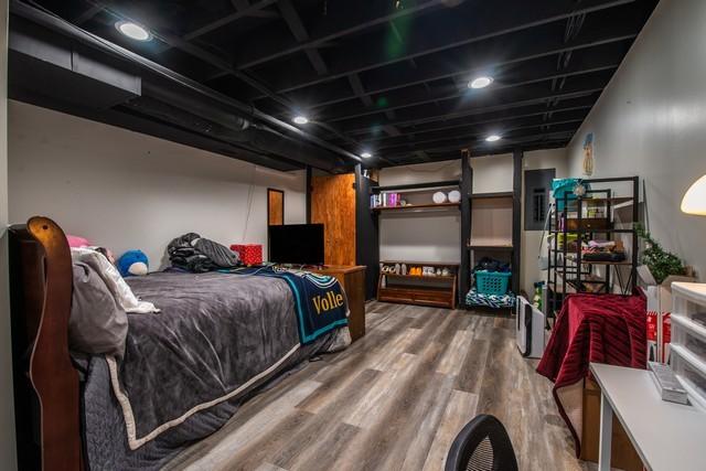 bedroom featuring wood-type flooring