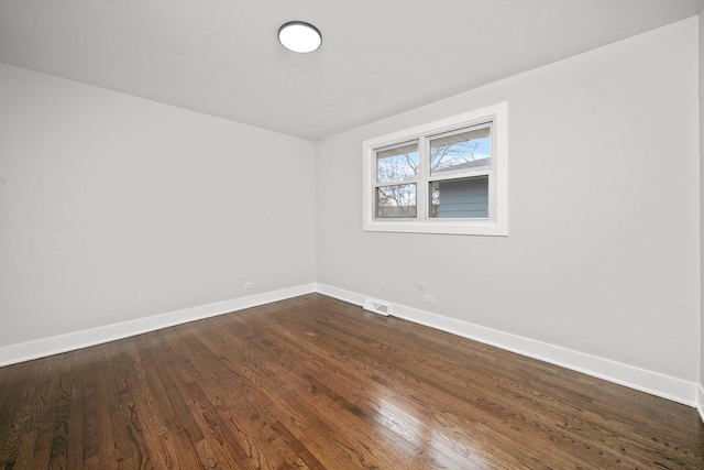 unfurnished room featuring dark hardwood / wood-style floors