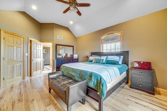 bedroom featuring ceiling fan, light hardwood / wood-style floors, and vaulted ceiling