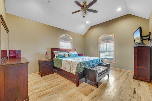 bedroom featuring ceiling fan, light hardwood / wood-style flooring, and vaulted ceiling