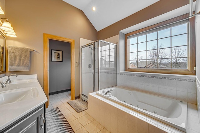 bathroom featuring tile patterned floors, vanity, shower with separate bathtub, and vaulted ceiling