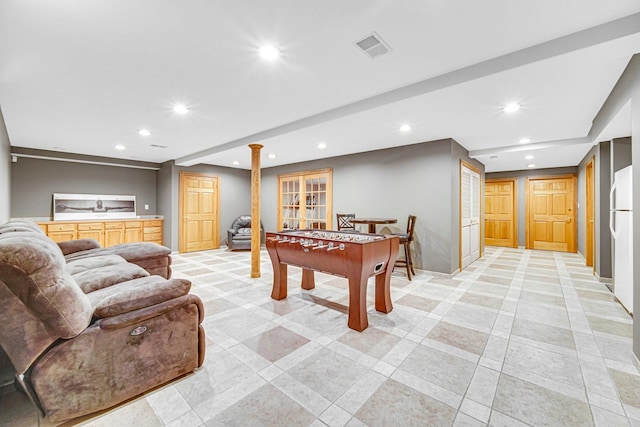 recreation room with decorative columns