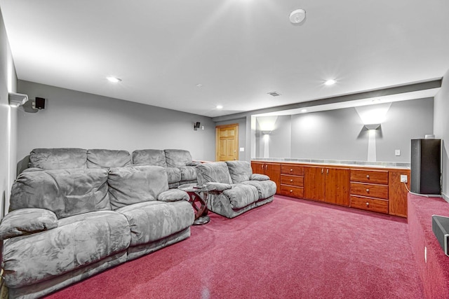 home theater featuring light colored carpet