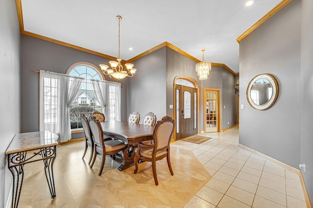 dining space with light tile patterned floors, an inviting chandelier, and ornamental molding