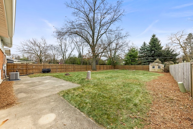 view of yard featuring a patio, a fenced backyard, central air condition unit, an outdoor structure, and a storage unit