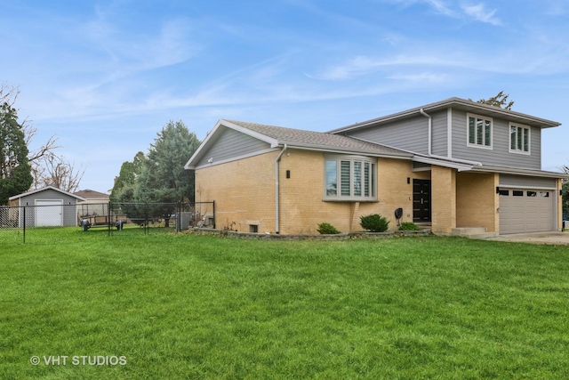 view of front of house with a front lawn and a garage