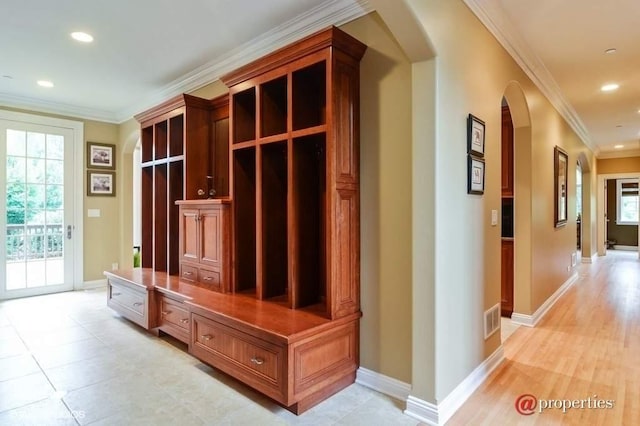 mudroom featuring ornamental molding