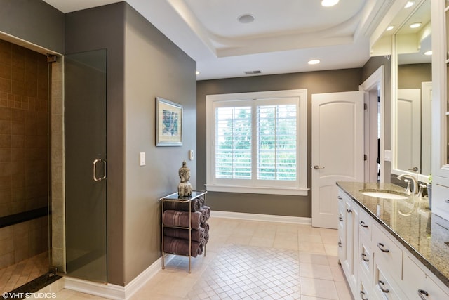 bathroom with vanity, a shower with shower door, tile patterned floors, and a raised ceiling