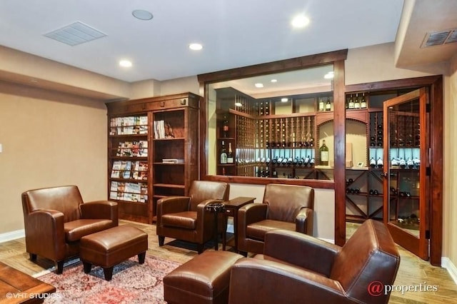 sitting room with light hardwood / wood-style flooring