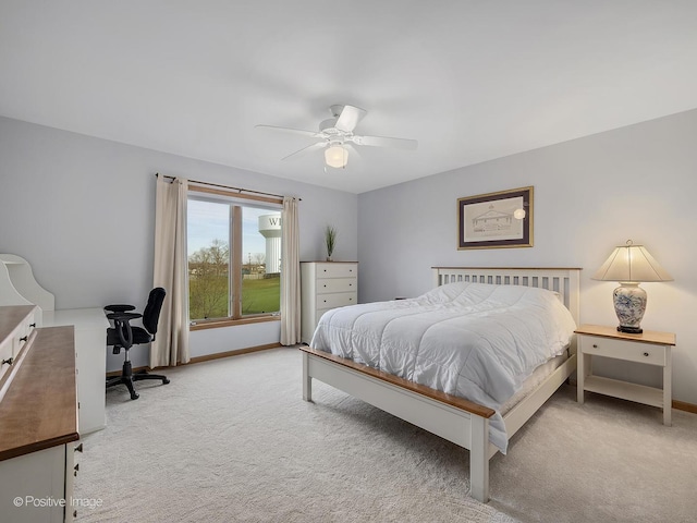 bedroom featuring ceiling fan and light colored carpet