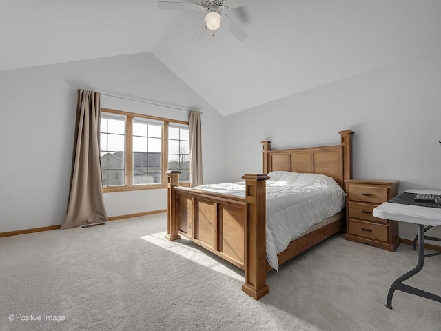 carpeted bedroom featuring ceiling fan and vaulted ceiling