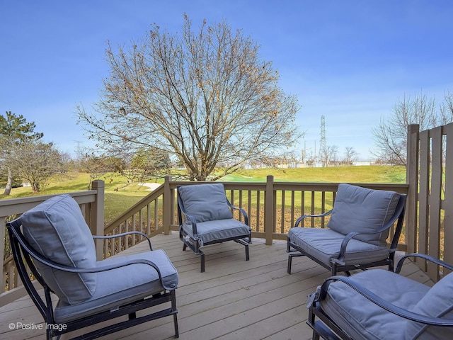 wooden terrace with a yard