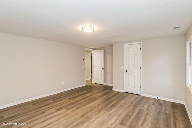 empty room featuring hardwood / wood-style floors