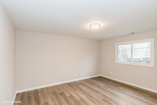 unfurnished room featuring light hardwood / wood-style floors