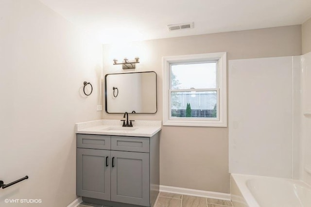 bathroom featuring vanity and shower / bath combination