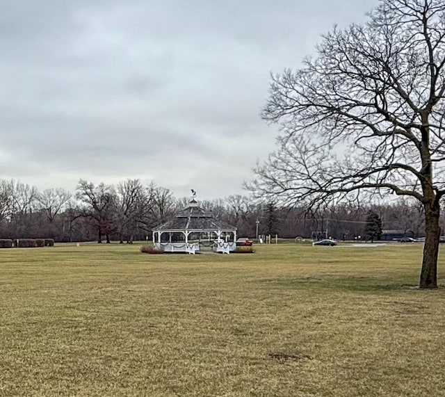 view of property's community featuring a gazebo and a lawn