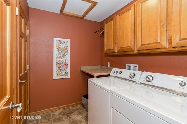 laundry area with tile patterned flooring, washer and dryer, and cabinets