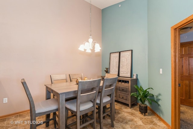 dining space with a chandelier