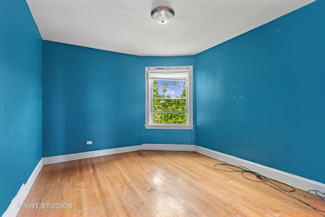 7730 S E End Ave, Chicago, IL 60649 - empty room featuring wood finished floors and baseboards