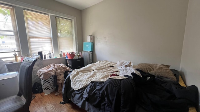 bedroom with wood-type flooring