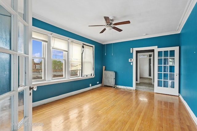 7730 S E End Ave, Chicago, IL 60649 - unfurnished room featuring radiator heating unit, wood finished floors, ceiling fan, baseboards, and ornamental molding