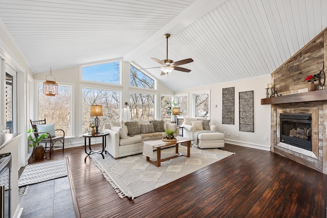 living area featuring high vaulted ceiling, a large fireplace, baseboards, beam ceiling, and hardwood / wood-style floors