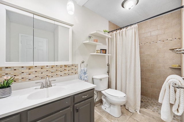 full bathroom with tiled shower, tile patterned flooring, vanity, and toilet