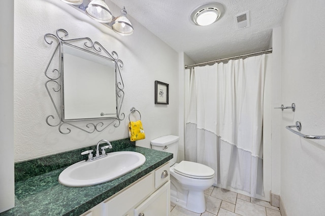 bathroom featuring visible vents, a shower with shower curtain, toilet, a textured ceiling, and vanity