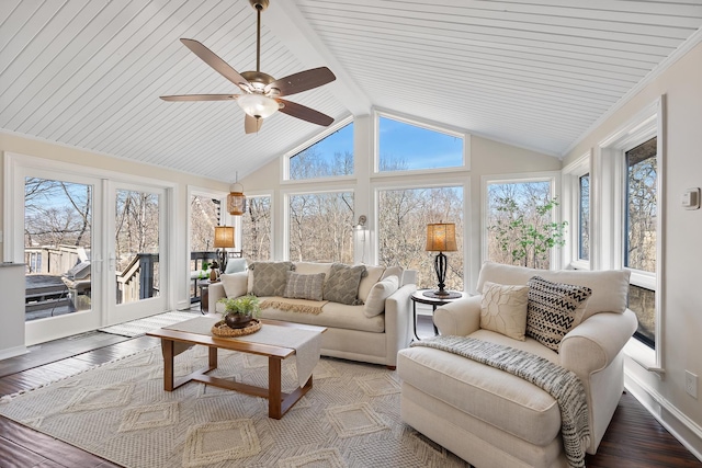 sunroom featuring vaulted ceiling with beams, ceiling fan, and french doors