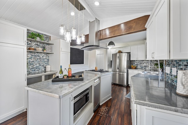 kitchen with a center island, vaulted ceiling with beams, appliances with stainless steel finishes, a sink, and island range hood