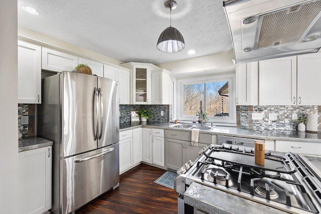 kitchen with range with gas cooktop, freestanding refrigerator, white cabinets, a sink, and dishwasher