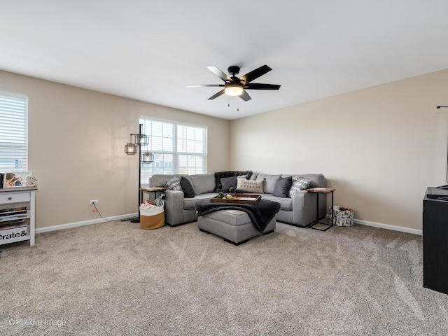 living room with ceiling fan and carpet floors