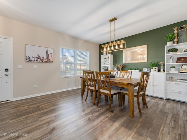 dining area with dark hardwood / wood-style flooring