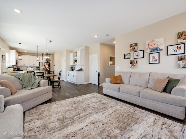 living room featuring dark hardwood / wood-style flooring