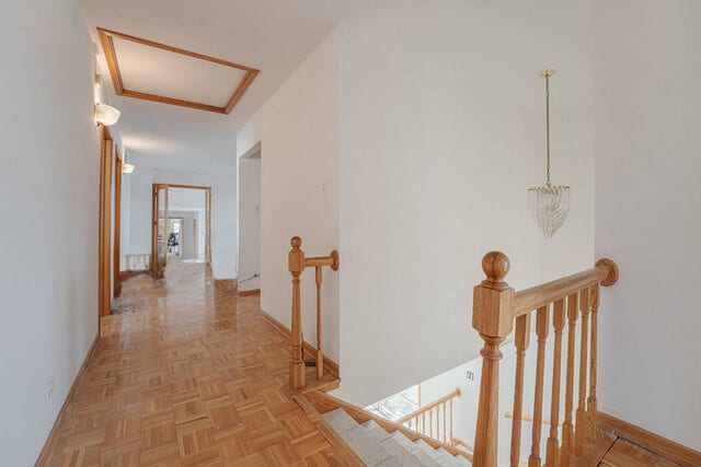 corridor with light parquet flooring