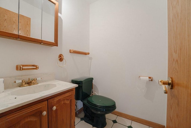 17043 Annetta Ave, Hazel Crest, IL 60429 - bathroom featuring toilet, vanity, baseboards, and tile patterned floors