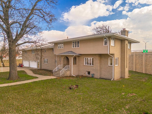 17043 Annetta Ave, Hazel Crest, IL 60429 - view of front of house with a chimney, a front lawn, and an attached garage
